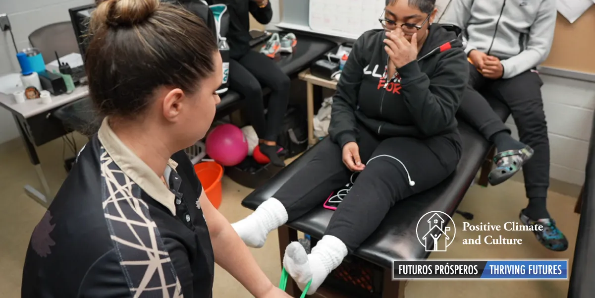 A student athlete receiving physical therapy