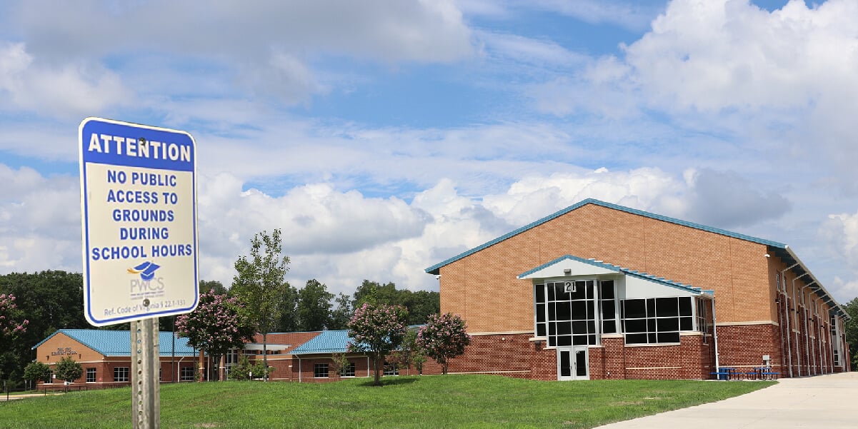 School and sign stating, "No public access to grounds during school hours"