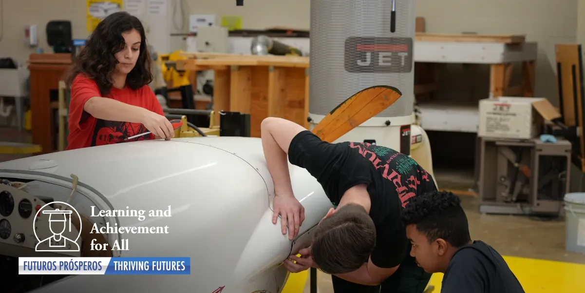 Students working on a plane in class