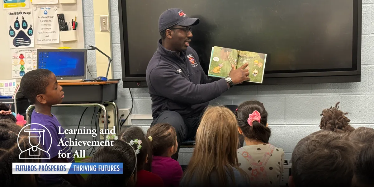 A Prince William County Firefighter reading to students