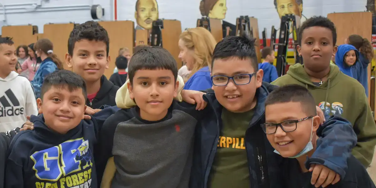 Group of students standing in a school cafeteria