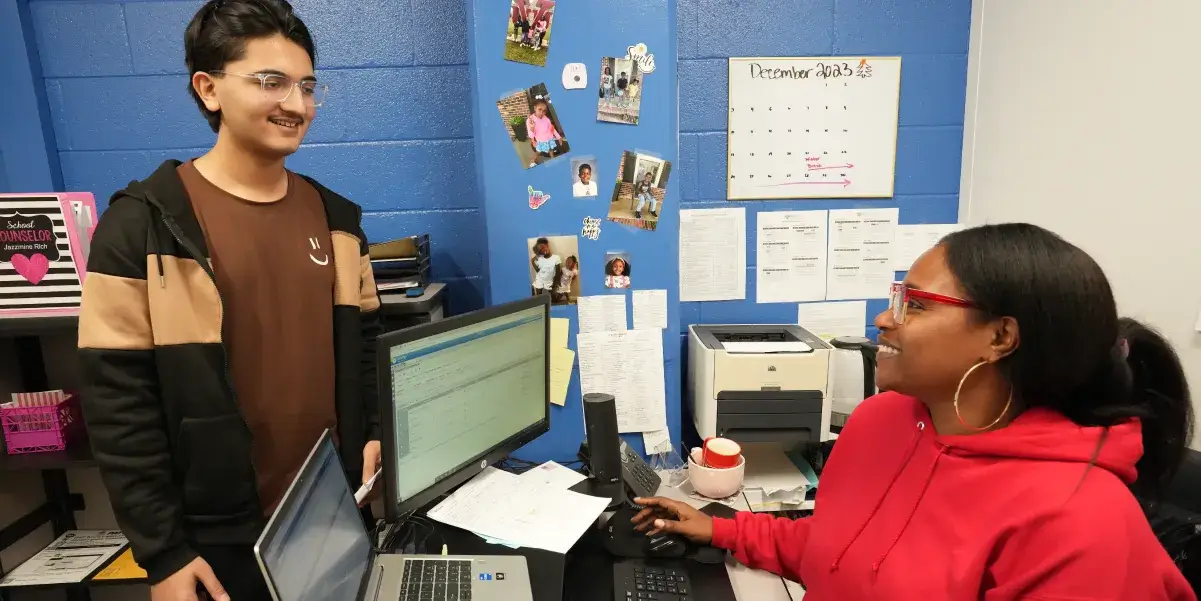 School counselor talking to a student in her office