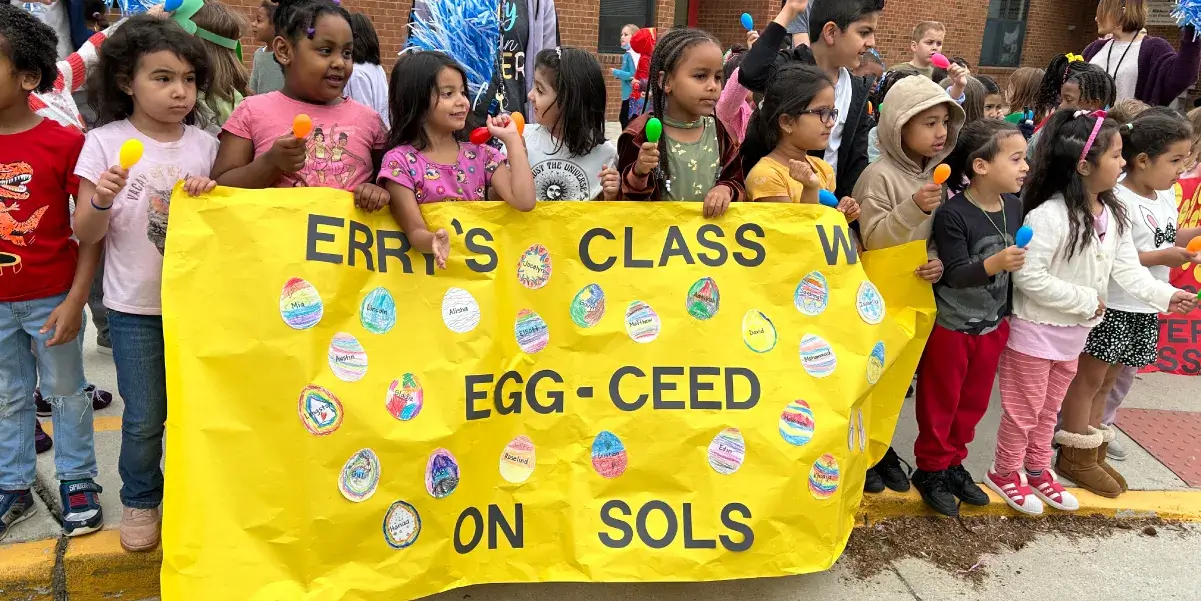 Students holding a sign at a Springwoods Elementary School SOL preparation event