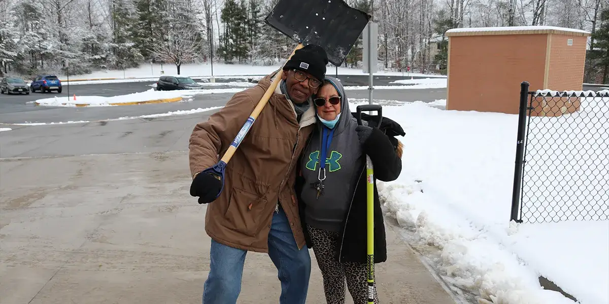 Custodians at Henderson Elementary School shoveling snow during the Code Red school closure on January 19, 2024