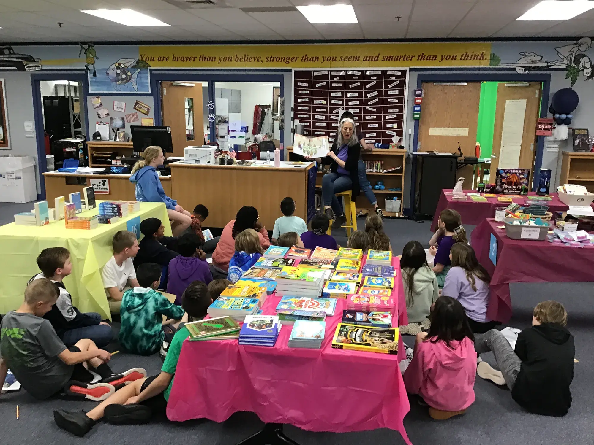 Karen Scott reads to students