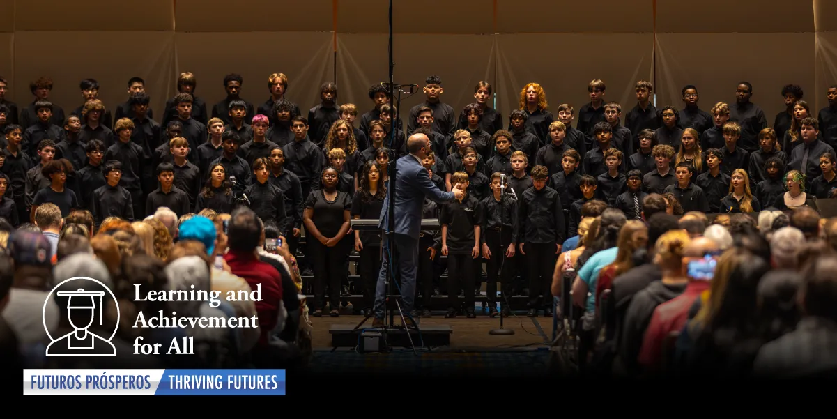 Graphic showcasing the entire group of students performing on stage in front of a crowd.