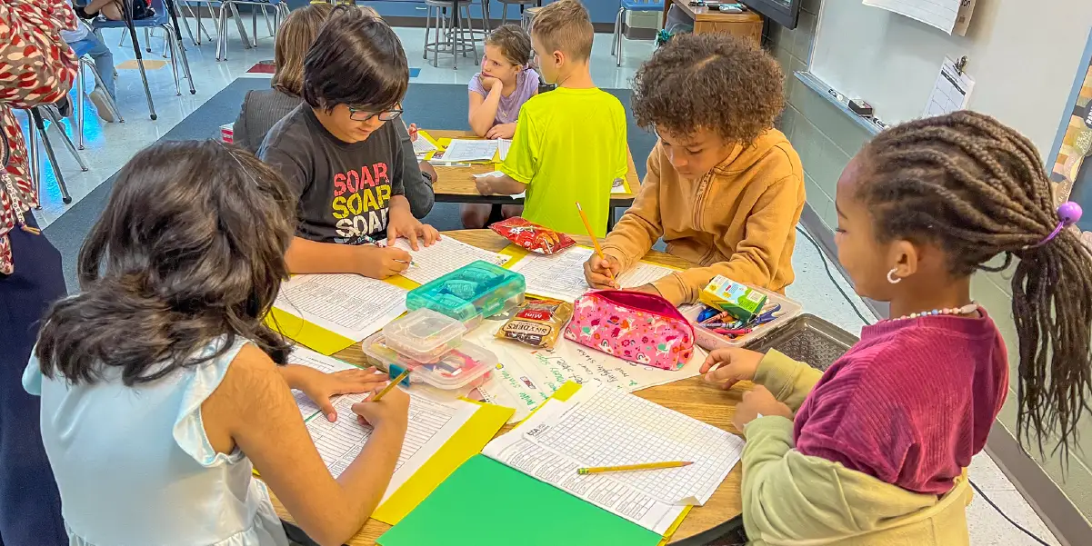 four students working on an assignment