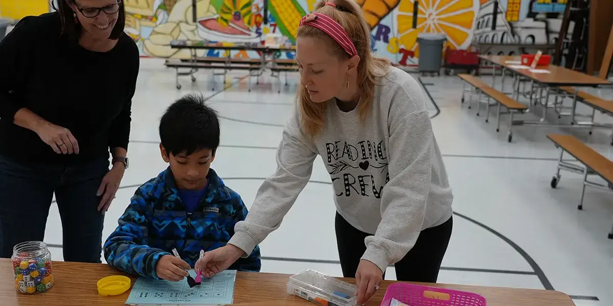 Student participates in literacy activity at Tyler Elementary School’s family literacy night