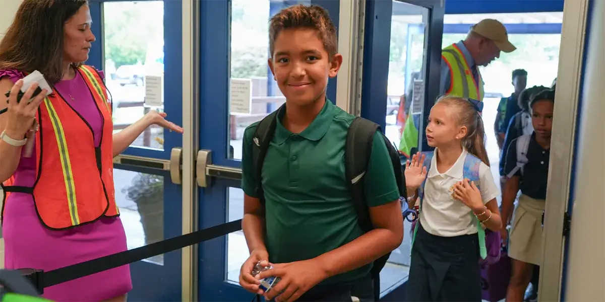 Pennington Traditional School students being welcomed as they enter the building for the first day of school