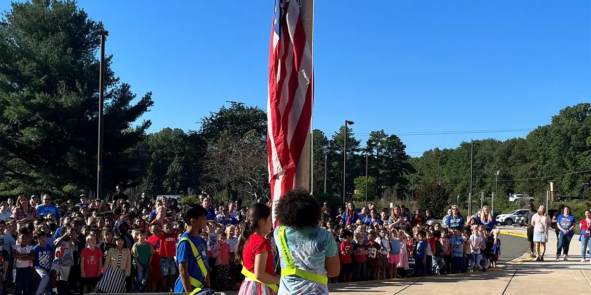 Pattie Elementary School safety patrol students leading a flag raising ceremony in commemoration of the anniversary of 9/11
