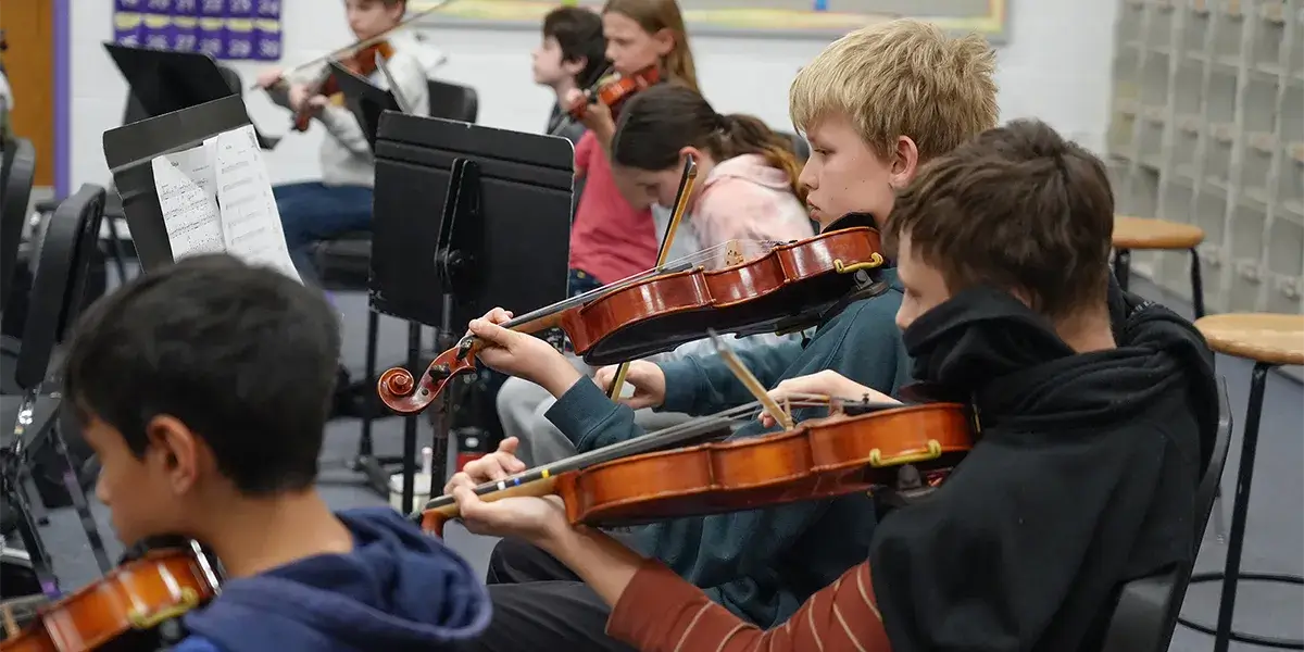 Benton Middle School strings students performing during class
