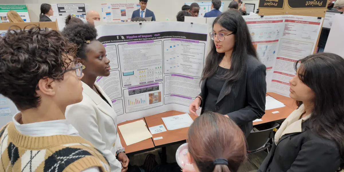 Student presenting her project at the 2025 Prince William-Manassas Regional Science and Engineering Fair
