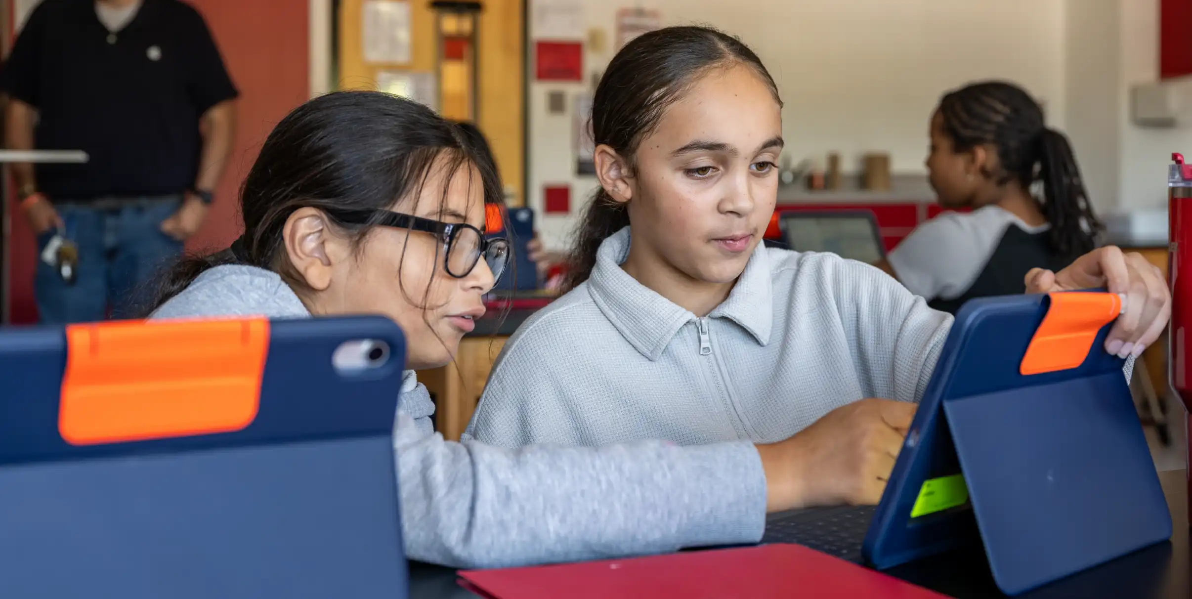 Two students using an iPad