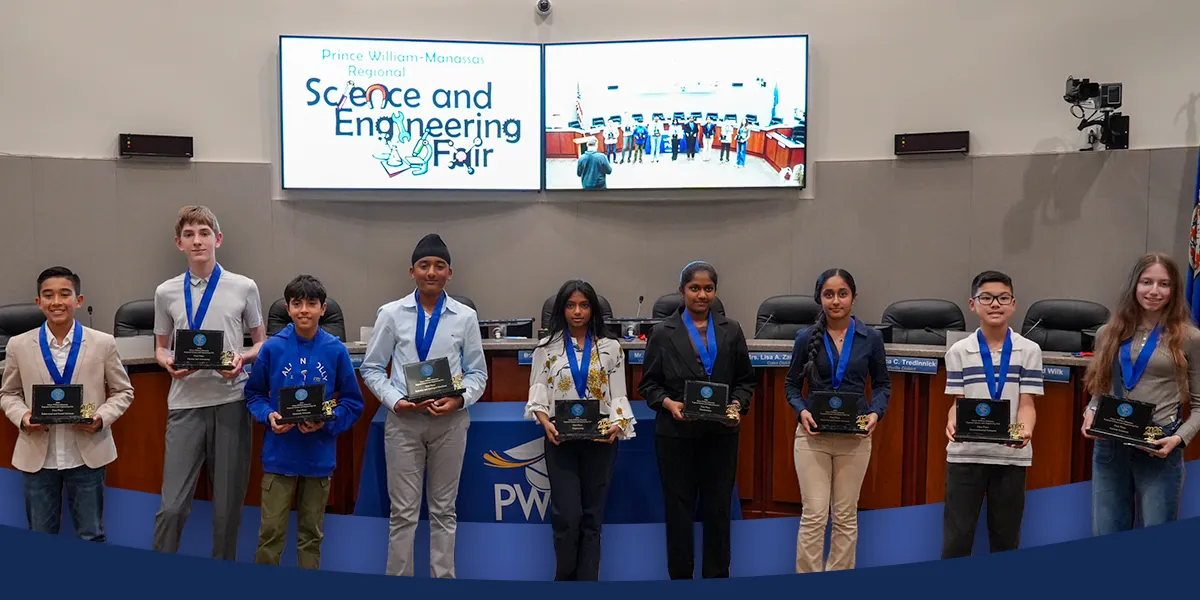 student science fair winners with their awards