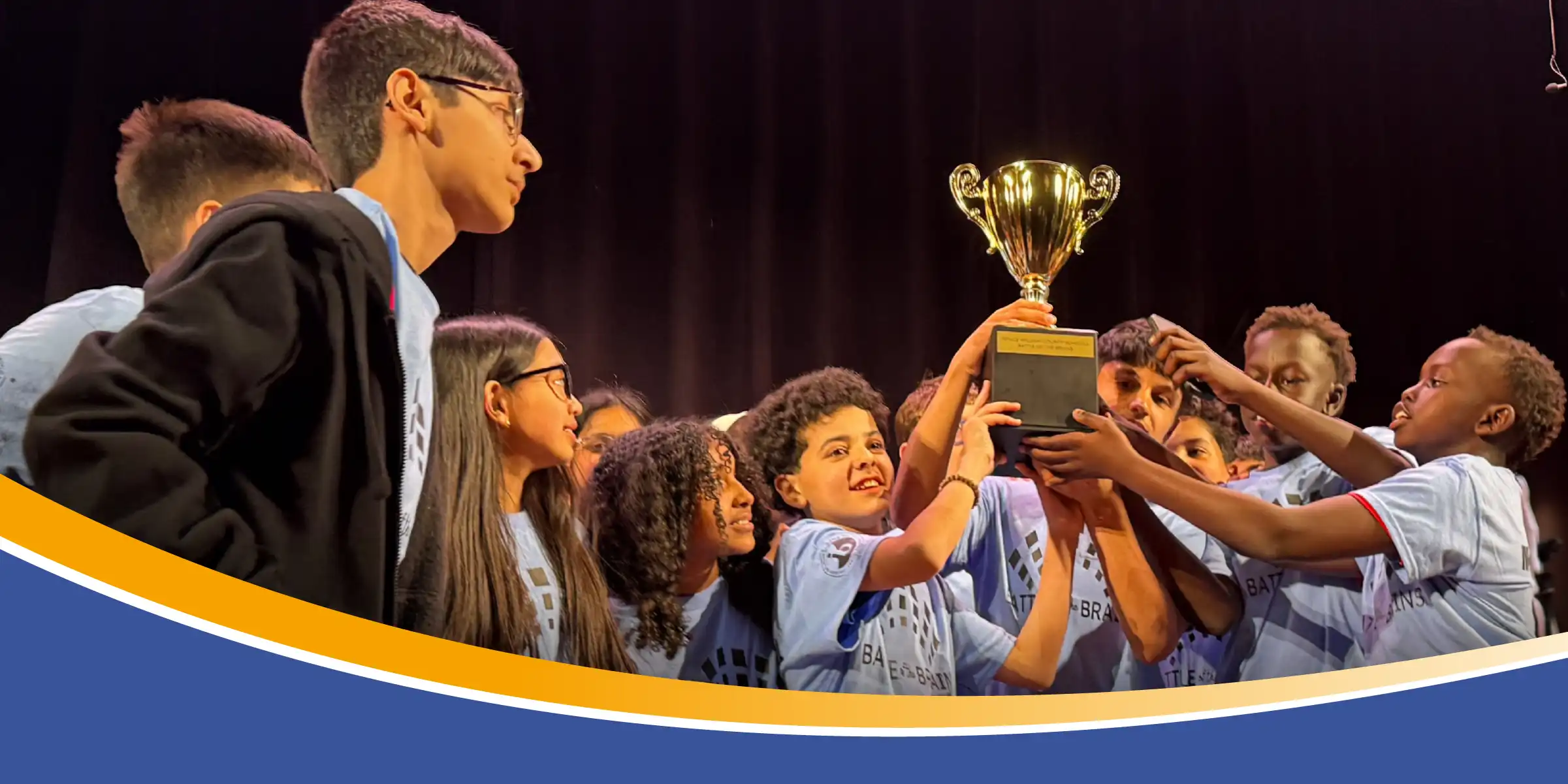 group of students holding trophy
