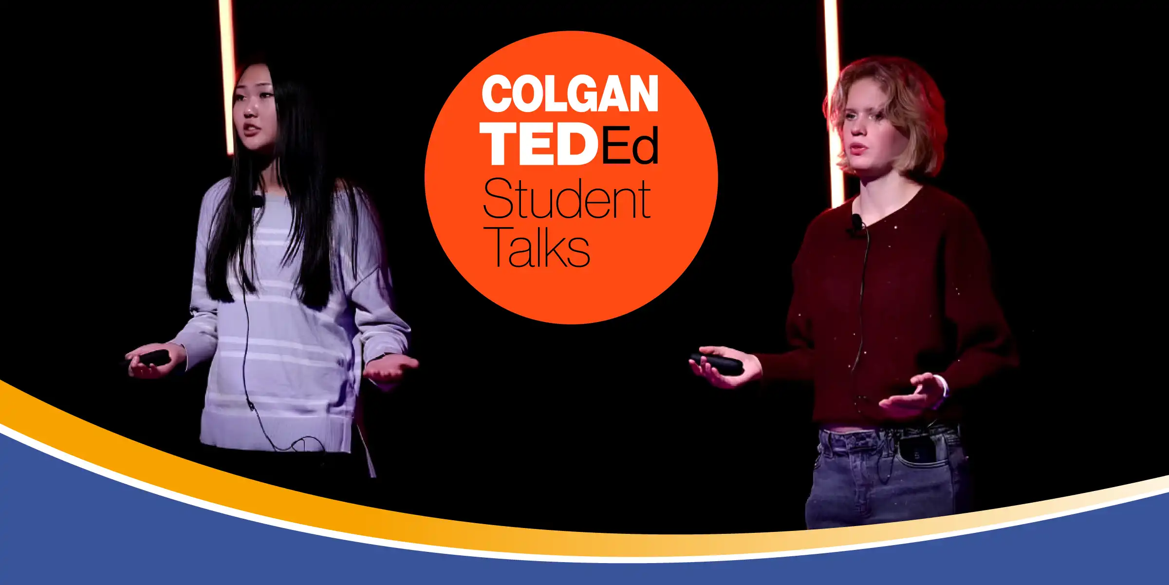 Two students onstage giving a talk beside a large red circle that reads “COLGAN TED-Ed Student Talks.”