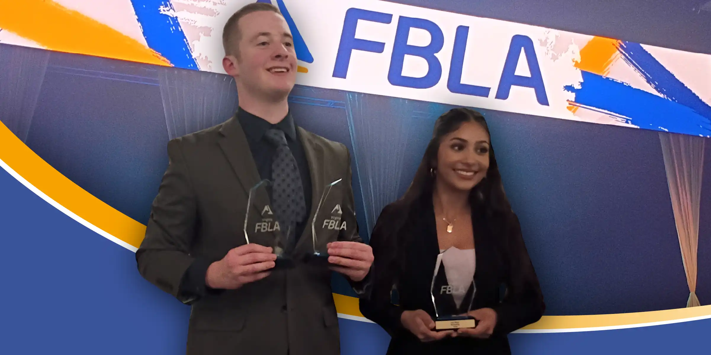 Two people in business attire smile while holding FBLA awards in front of a blue FBLA conference backdrop.