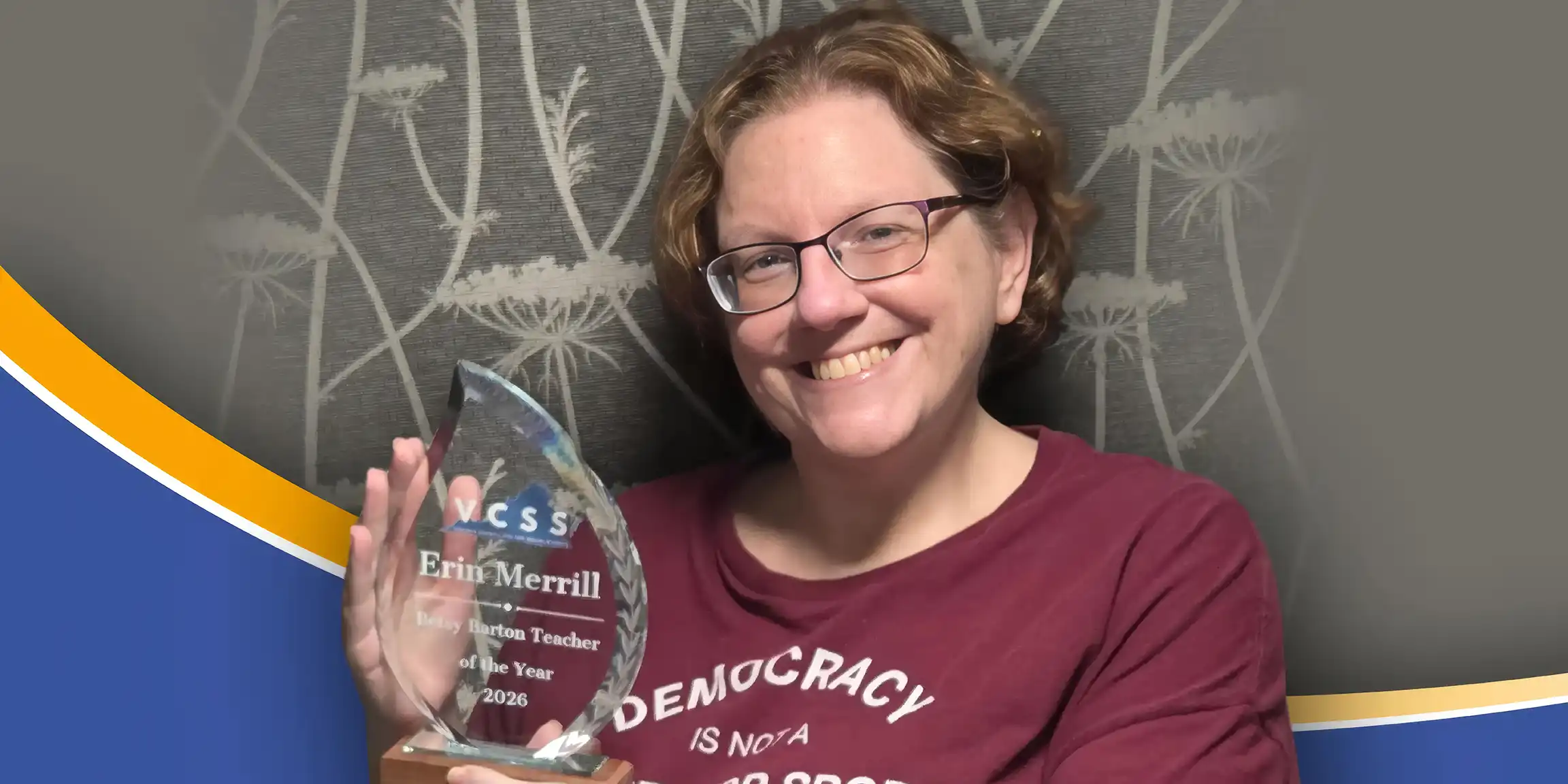 Smiling woman with glasses holds a clear glass award plaque that reads “VCSS Erin Merrill … Teacher of the Year 2026.”