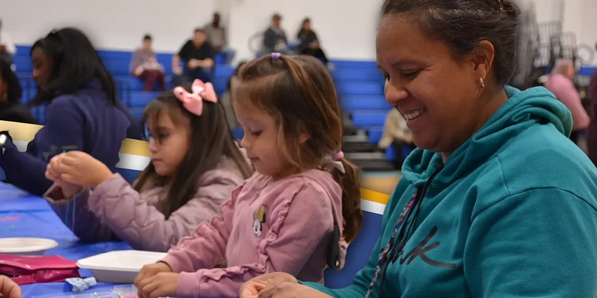 Families participating in an arts and crafts activity at the Saunders Middle School Fall Festival