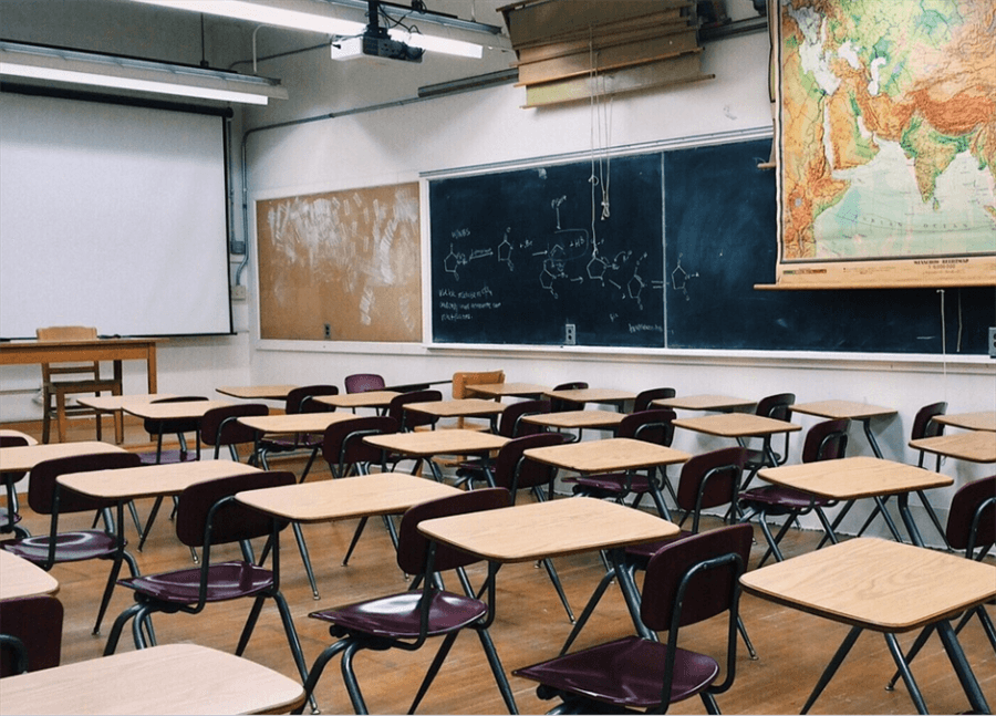 A classroom with desks and chairs