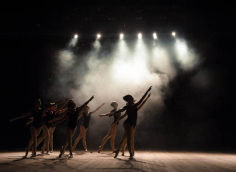 group of ballerinas dancing on stage