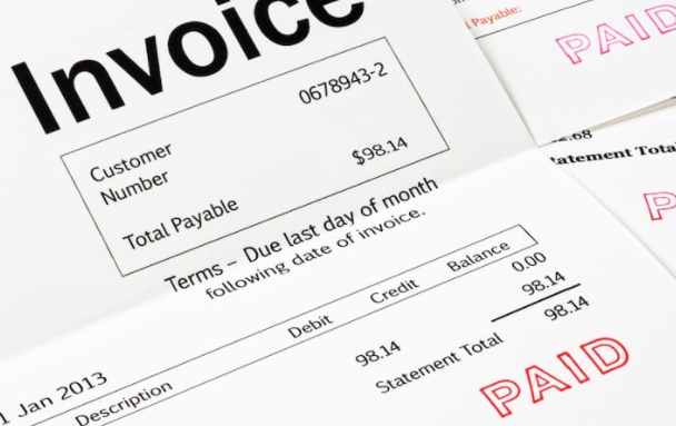 An invoice with the word paid stamped on it