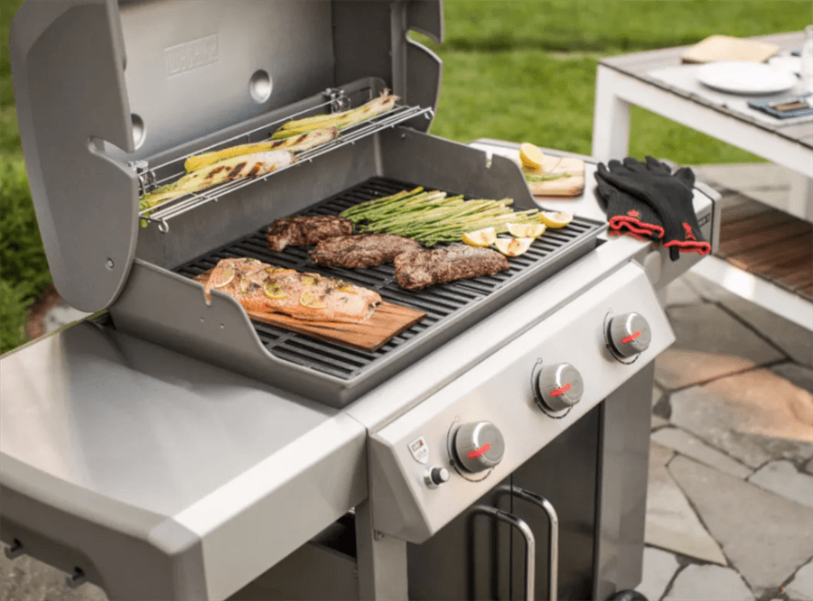 Photo of a gas grill with food cooking