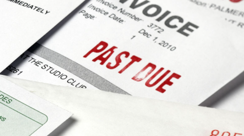 An invoice with the words past due stamped at the top An invoice with the words past due stamped at the top