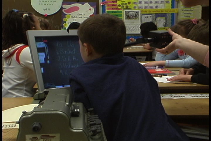 Students sitting at their desks in a classroom