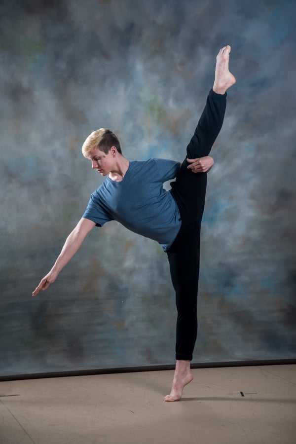 Male dancer with leg extended above head