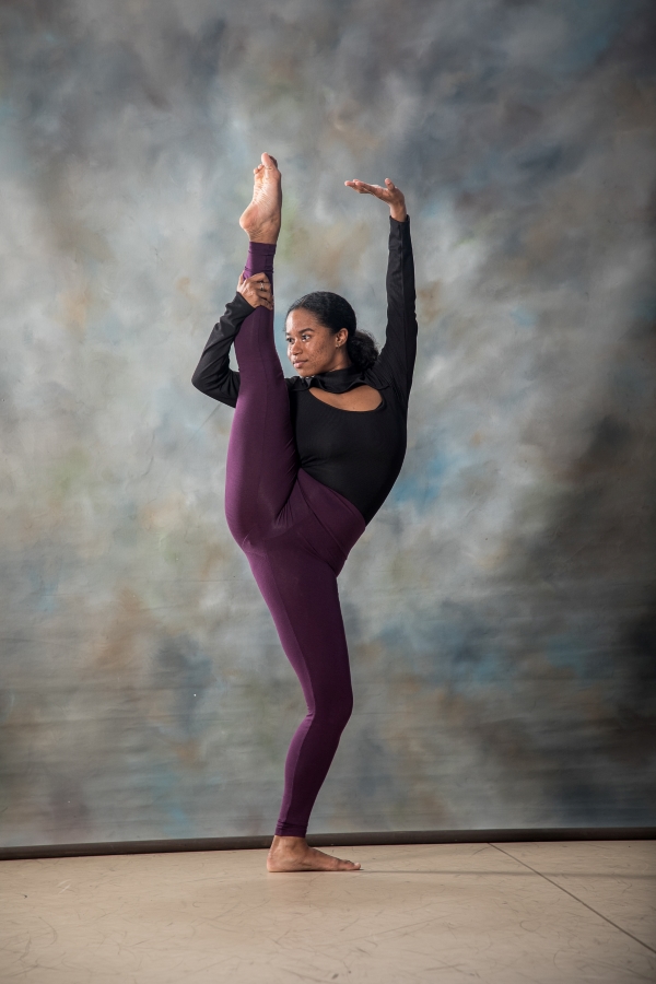 Female dancer with leg extended above head