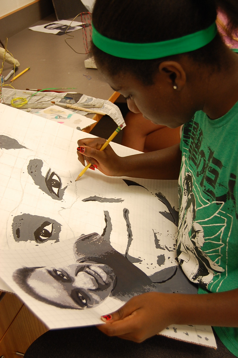 Student drawing a self portrait in black and white