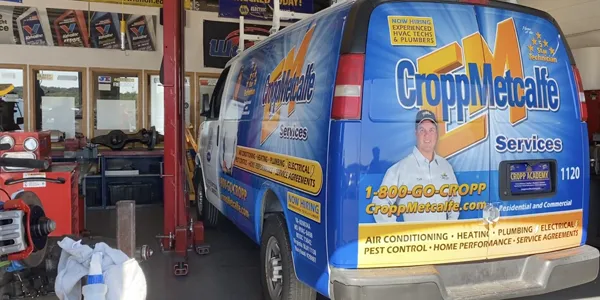 Van being worked on in a garage