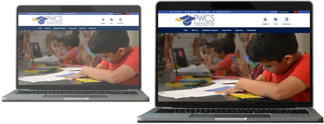 Two laptops open with the screens showing students working at desks