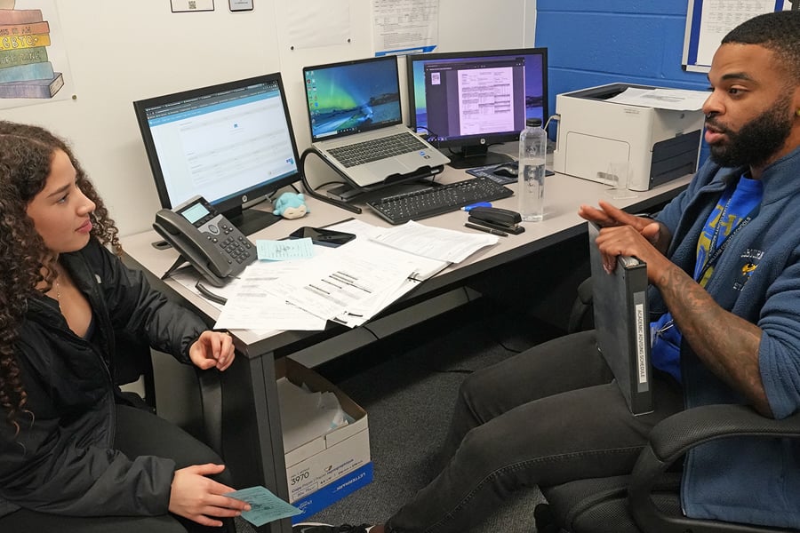 School counselor meeting with student for academic advising
