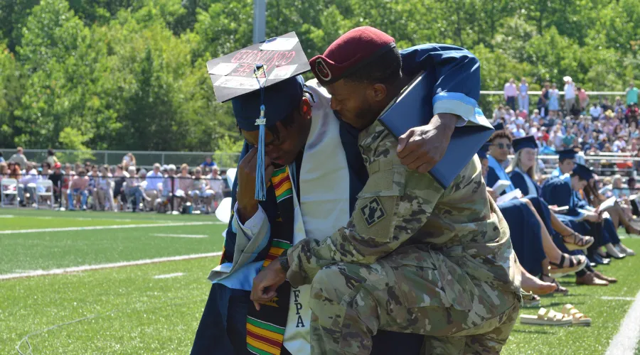Colgan high school senior with father at graduation