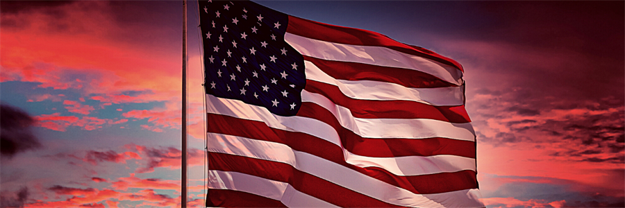 American flag flying outside at sunset American flag flying outside at sunset
