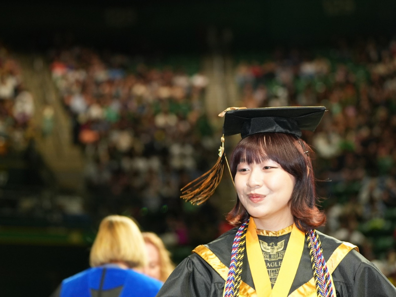 Freedom High School graduate in cap and gown