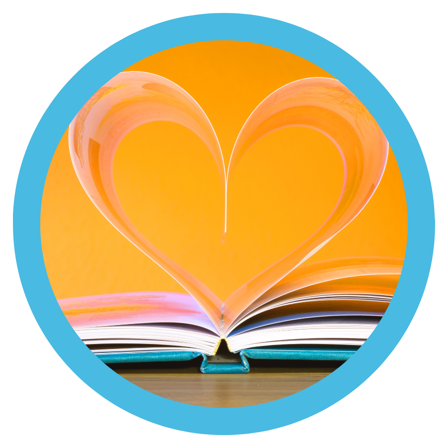photo of an open book with heart coming out of the pages