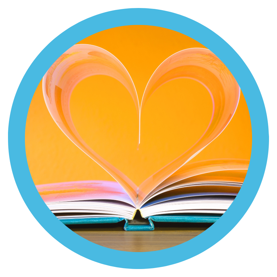 photo of an open book with heart coming out of the pages